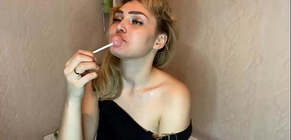 trendsCharming Lady in Sexy Lingerie Licking Lollipop